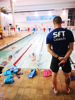 Swim for Tri coach Dan Bullock providing instruction from the poll side.