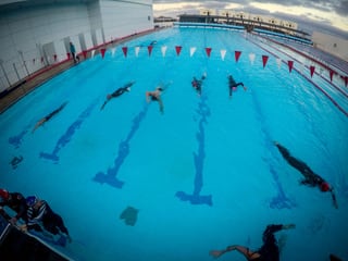 Swim for Tri - Italy swim camp swimmers entering the sea